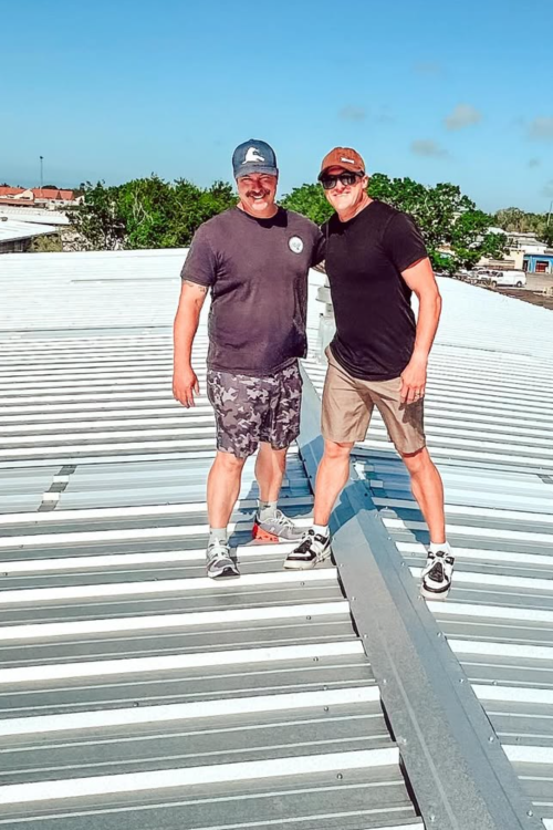 clough roofing owners on a roof